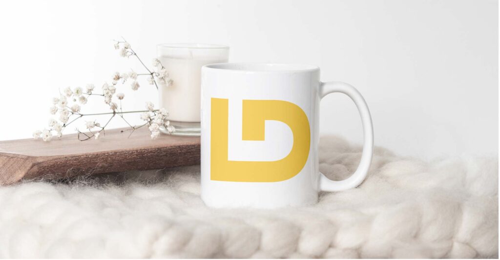 A photo of the Lemonade Design Co logo on a mug