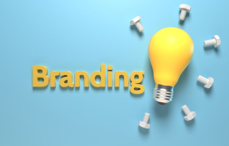 A photo of a yellow lightbulb looking at why your brand is more important than your logo