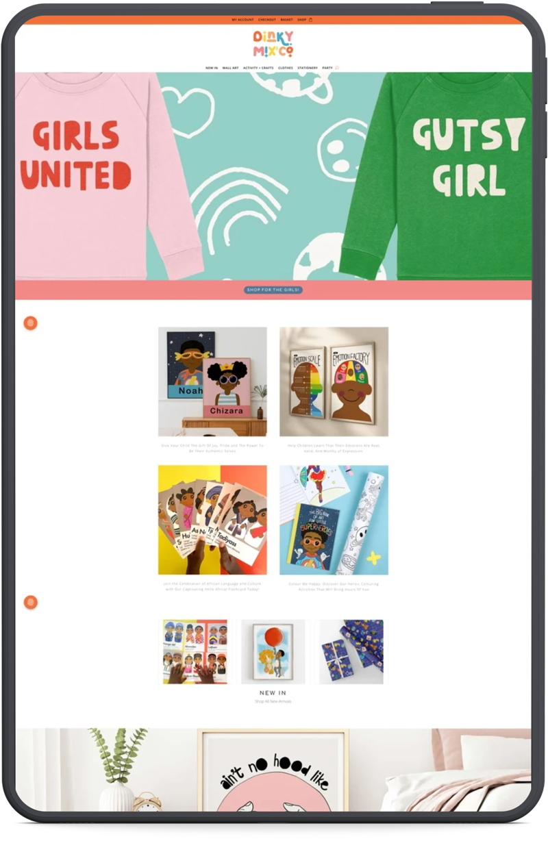 Dinky Mix mockup: "Custom WordPress website design for Dinky Mix, a children's clothing and gift brand, shown on a tablet"