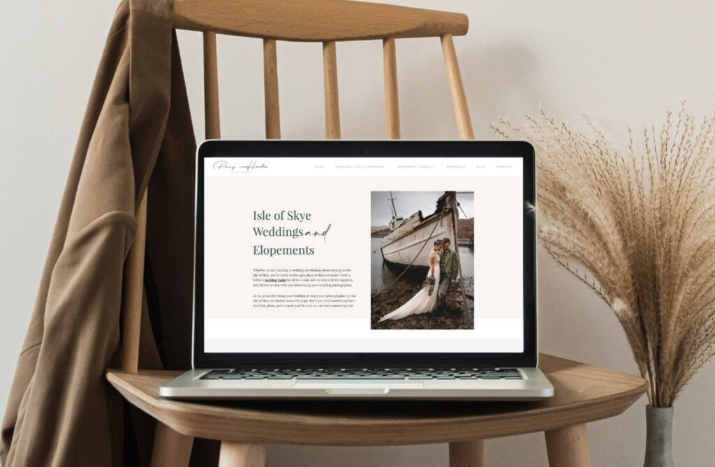 Laptop displaying the Isle of Skye Weddings and Elopements website design, resting on a wooden chair